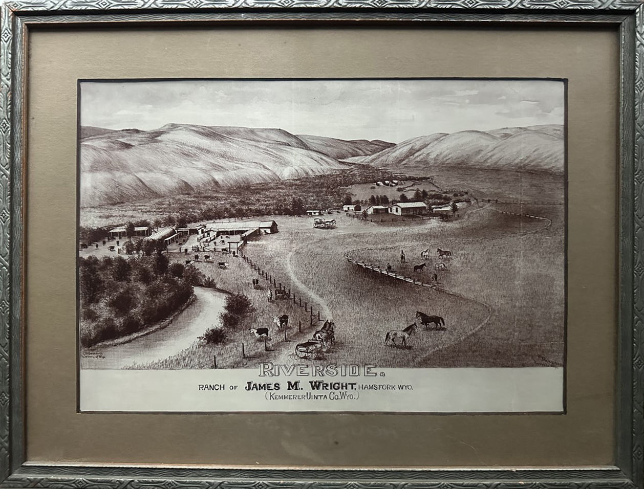 A bird’s-eye pen and ink sketch of Riverside racnch, situated along a road curving through a valley between two low mountains. A river follow the curve of the road in the bottom left corner.