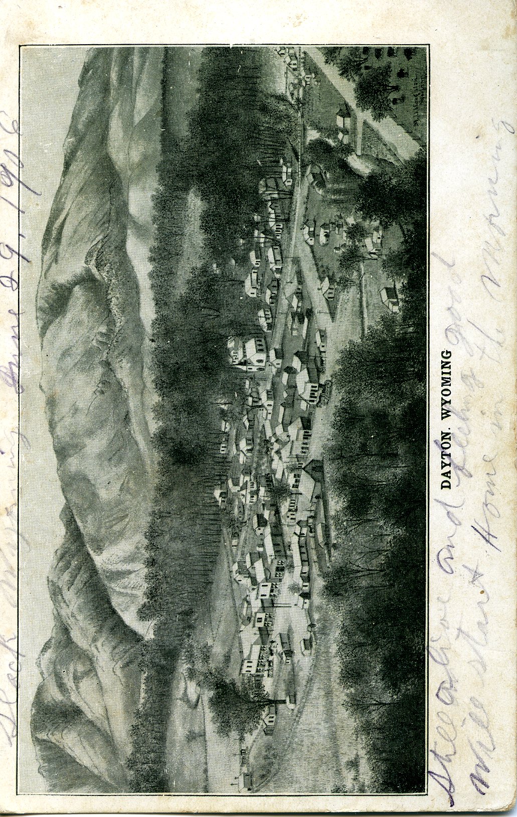 A postcard depicting a pen and ink drawing of the small town of Dayton, Wyoming. An aerial view shows the town souround by groves of trees, below a mountain.